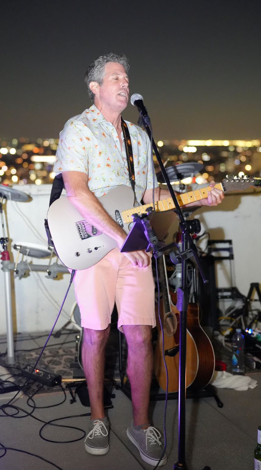 Playing his son's wedding party.