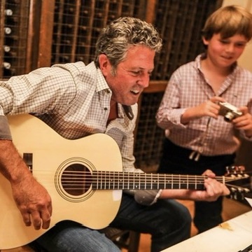 Ron Cohler playing acoustic guitar
